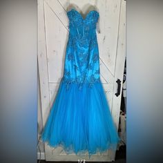 New With Tags In Size 4 By Xcite In A Peacock Blue. Padded Bust. 17” Pit To Pit 25” Waist 54” Long Prom Blue, Pageant Gown, Pageant Gowns, Peacock Blue, Corset Dress, Fit & Flare, Prom Dresses, Size 4, Prom