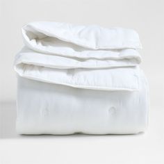 the white sheets are folded on top of each other