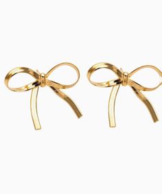 Get ready to make a sweet statement with these Girly Bow Studs! These gold earrings are not just stylish, but also lead and nickel free, keeping your ears happy. Perfect for adding a touch of playful charm to any outfit. (And no worries for sensitive ears!) Lead + Nickel Free Girly Bow Stud Earrings Made in the US Trendy Yellow Gold Party Earrings, Trendy Gold-tone Earrings For Gift, Cute Clip-on Earrings As A Gift, Gold Clip-on Earrings As Gift, Chic Metal Clip-on Earrings For Gift, Gold Nickel-free Hoop Earrings For Party, Chic Gold Earrings For Gift, Chic Gold-tone Earrings Perfect As A Gift, Chic Gold-tone Earrings For Gift