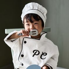 Calling all mini cooks! Our junior chef hat and coat will inspire you to jump into the play kitchen and create your next pretend culinary masterpiece. Great for imaginative play and dress-up time, the kid-sized chef hat and coat have embroidered details, high-quality cotton fabric and a soft hand-feel. Accessorize with our Junior Chef Apron to complete this foodie-friendly look.   • Kids chef coat and hat for dress-up play  • Suitable for kids ages 3-6 years old.  • Sophisticated embroidered loo Junior Chef, Kid Chef, Chef Coat, Chef Hat, Chef Apron, Chefs Hat, Embroidered Details, Play Kitchen, Soft Hands