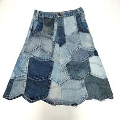 a women's skirt made out of old blue jeanette shorts with patches on the side