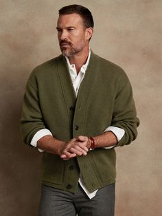 Made from a blend of extra fine Merino wool, this soft and warm cardigan is knitted in a subtly textured half-Milano stitch, which adds soft structure for refined appeal.  OVERSIZED FIT: Relaxed, boxy fit with a dropped shoulder.  Standard fit.  Long Knitted Jacket Men, Cardigan Sweater Men, Cardigan Sweater Outfit Men, Soft Knit V-neck Outerwear, Classic V-neck Soft Knit Outerwear, Cozy Wool V-neck Sweater For Work, Classic V-neck Sweater With Button Closure For Layering, Soft Knit V-neck Sweater Coat For Layering, V-neck Sweater Coat For Layering