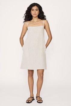 Elevate your style with our mini dress—a chic and versatile piece that features a square neckline, adjustable straps for the perfect fit, and a vent at the back for ease of movement. Completing the look is a practical side zip, ensuring both style and convenience for any occasion. Made with organic linenLined with organic cottonHandmade in IndiaMachine wash cold on delicate cycle, lay flat to dry, warm iron as needed Honoring Earth + Maker Each of our wovens are handcrafted in India, preserving Linen Midi Dress, Linen Mini Dress, Indian Textiles, Square Necklines, Natural Linen, Square Neckline, Lay Flat, Side Zip, Adjustable Straps