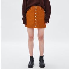 Zara High-Waisted, Front Button, Corduroy Mini Skirt. Size Small. The Color Is A Dark Orange/Copper Color. Never Worn And In Perfect Condition! Casual Button-up Fall Skirt, Orange Cotton Skirt For Fall, Trendy Brown Mini Skirt With Buttons, Trendy Brown Mini Skirt With Button Closure, Fall Corduroy Mini Skirt With Buttons, Zara Skirt With Pockets For Fall, Zara Brown Casual Mini Skirt, Casual Brown Zara Mini Skirt, Brown Cotton Skirt With Buttons