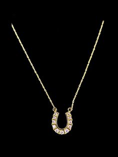 The symbol of the horseshoe has been used as a vessel for good luck for centuries. This necklace is a golden horseshoe centerpiece lined with round glittering CZ crystals, with gold linked chain attached to each side. Gold plated pendant and chain. Pendant is 1/2" long. Chain is adjustable 16-18" long. Gold Horseshoe Jewelry With Adjustable Chain, Gold Horseshoe Necklace With Adjustable Chain, Gold Horseshoe Necklace For Formal Occasions, Formal Gold Horseshoe Necklace, Horseshoe Necklace Gold, Horseshoe Necklace, Gold Link Chain, For Good Luck, Crystal Accessories