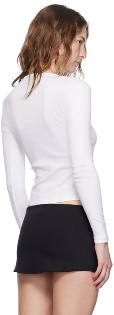 Cotton jersey T-shirt. Rib knit crewneck. Supplier color: White Ribbed Crew Neck T-shirt For Layering, Sporty Crew Neck T-shirt For Layering, Sporty Fitted Top With Ribbed Neckline, Sporty Fitted Crew Neck Sweater, Casual White Turtleneck T-shirt, Sporty Ribbed Crew Neck Tops, Cotton Crew Neck Top With Ribbed Cuffs, White Fitted Top With Ribbed Cuffs, Sporty Tops With Ribbed Neckline And Stretch Fit