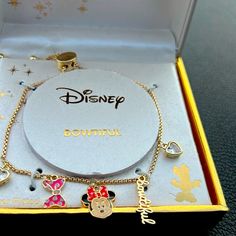 Disney Minnie Mouse Charm Bracelet , Iconic Face, The Word Beautiful, 2 Heart Shaped Crystal And A Pink Bow Makes Up The Dangling Charms. Pull Chains Adjust To A Comfortable Fit. Fine Silver Plated , Gold Tone Color. Disney Heart Shaped Jewelry Gift, Disney Heart-shaped Jewelry Gift, Silver Disney Charm Bracelet Gift, Silver Disney Charm Bracelet As A Gift, Adjustable Disney Style Bracelets, Disney Style Pink Jewelry Gift, Pink Disney Jewelry For Gifts, Pink Disney Jewelry For Gift, Disney Jewelry For Valentine's Day Gift