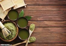 green powder in bowls with spoons and bamboo utensils