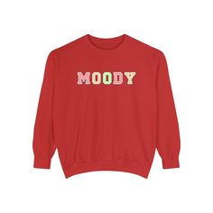 Step into the world of comfort and style with our Moody Magic Women's Comfort Color Sweatshirt. Crafted for both coziness and trendiness, this sweatshirt is perfect for embracing those moody vibes with a touch of magic. Made from high-quality, soft Comfort Color fabric, it ensures maximum comfort, making it your go-to piece for chilly days or relaxed outings. The "Moody Magic" design adds a trendy and expressive element to your wardrobe, allowing you to showcase your unique personality. Whether Trendy Red Sweater For Loungewear, Red Trendy Sweater For Loungewear, Trendy Sweatshirt With Letter Print And Cozy Fit, Trendy Red Cotton Sweatshirt, Trendy Cotton Sweats With Cozy Fit, Trendy Slogan Sweatshirt For Leisure, Trendy Text Print Sweater For Loungewear, Trendy Red Sweater With Letter Print, Trendy Text Print Sweatshirt For Loungewear