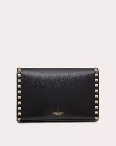 Valentino Garavani Small Rockstud Grainy Calfskin Crossbody Bag in Nero Hook closure Adjustable shoulder strap Interior: open slip pocket Platinum-finish metal studs and hardware Calfskin exterior Cotton lining 8.9" W x 5.9" H x 2.4" D Strap drop: 21.5” Made in Italy Elegant Evening Shoulder Bag With Rivets, Designer Evening Bags With Rivets, Formal Leather Bags With Studs, Designer Formal Bags With Studs, Evening Crossbody Shoulder Bag With Rivets, Luxury Shoulder Bag With Rivets, Luxury Evening Shoulder Bag With Rivets, Luxury Studded Shoulder Bag For Formal Occasions, Luxury Formal Shoulder Bag With Studs