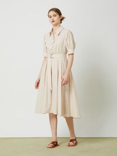 This belted flared long dress exudes a feminine and elegant style with its flared silhouette, shirring at the waist, and voluminous sleeves.- Long length that makes your outfit stylish- A-line silhouette to add appeal to the item- D-ring belt detail for added interest* The color of the actual product may vary due to differences in monitor color settings and resolution. Spring A-line Dress With Belt, Elegant Summer Puff Sleeve Dress With Belt, Feminine A-line Midi Dress With Pleated Sleeves, Spring A-line Belted Dress, Elegant A-line Midi Dress With Belt, Workwear A-line Maxi Dress With Belt, Workwear Belted A-line Maxi Dress, Belted Knee-length Puff Sleeve Summer Dress, Spring Evening Pleated Belted Dress