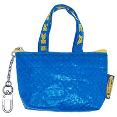 a blue handbag with a yellow and white logo on the front, attached to a chain