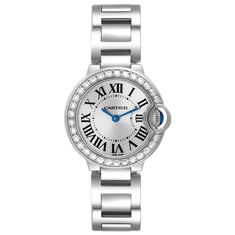 Cartier Ballon Bleu White Gold Diamond Bezel Ladies Watch WE9003Z3. Quartz movement. Caliber 057. Round 18K white gold case 28.0 mm in diameter. Case thickness: 9.35 mm. Fluted crown set with a blue sapphire cabochon. 18K white gold bezel set with original Cartier factory diamonds. Scratch resistant sapphire crystal. Silver sunburst dial with Roman numerals. Blued steel sword shape hands. 18k white gold bracelet with hidden butterfly clasp. Fits 6.5" wrist. Cartier White Watch With Metal Dial, White Cartier Watch With Metal Dial, Cartier White Watches With Subdials, White Cartier Watch With Subdials, Cartier Watch With Metal Dial Round Shape, Cartier Round Watch With Metal Dial, Cartier Watch With Metal Dial, Cartier Silver Watch With Subdials, Cartier Watch Accessories With White Round Dial