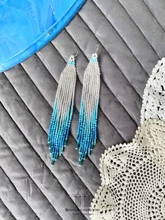 "These are bohemian bridal beaded earrings made with love for you. It also makes an excellent gift for birthdays, anniversaries, mother's day, valentine's day and more. ♡ Bead Length - 5.5\" (14 cm) ♡ Total Length - 5.9\" (15 cm) ♡ Width - 0.8\" (2 cm) ♡ Quality Czech beads If you like these white and turquoise seed bead earrings, but would like them in a different color please email me and I do special orders. I accept payments through Paypal. The colors can slightly differ from the photo becau Bohemian Silver Tassel Earrings With Beaded Fringe, Beaded Fringe Dangle Jewelry For Beach, Bohemian Round Beads Earrings For Wedding, Turquoise Tassel Earrings With Dangling Beads, Turquoise Beaded Tassel Earrings For Festival, Bohemian Round Bead Wedding Earrings, Beach Dangle Jewelry With Beaded Fringe, Bohemian Wedding Earrings With Round Beads, Turquoise Beaded Fringe Dangle Tassel Earrings