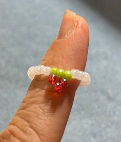 Strawberry bead ring.  Colors are red, green and white.  Can mix and match colors.  All sizes available. White Adjustable Casual Rings, Green Beaded Rings For Gifts, Red Beaded Rings For Gifts, Green Beaded Rings For Gift, Casual White Adjustable Rings, Red Beaded Rings As Gift, Red Beaded Rings Perfect As Gifts, Adjustable White Rings With Tiny Beads, Casual Handmade Rings As Gifts