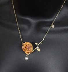 Beautiful natural  rose necklace. A  Resin sealed dried real rose on a leaf vine  with pearl accent beads on a golden chain. Give her roses that will last forever  and she can wear them.! Great gift idea Gold Pearl Flower Necklace, Gold Pearl Flower Necklace For Gift, Delicate Pearl Flower Necklace Gift, Delicate Pearl Flower Necklace For Gift, Elegant Handmade Rose Necklace, Forever Flower, Real Rose, Forever Flowers, Golden Chain