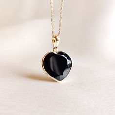 This stunning heart pendant is set in 14K Solid Yellow Gold with Natural Black Onyx with utmost precision. It is an unique gemstone pendant for nearly every occasion and is completely hassle-free jewelry. 🔷ABOUT GEMSTONE:  Black onyx is often considered a protective stone. It is believed to absorb and transform negative energies, preventing them from affecting the wearer. Black onyx is associated with strength, both physical and emotional. It is believed to provide inner strength, resilience, a Gold Heart Pendant, Handmade Jewelry Box, Zodiac Capricorn, Bezel Pendant, December Birthstone, Unique Gemstones, Inner Strength, Gold Heart, 14kt Gold