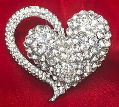 "Vintage Valentine Rhinestone Double Heart Pin Pendant Brooch is a puffy double heart that is completely encrusted with gorgeous, sparkling clear rhinestones in silver tone metal.  This is probably the largest and most spectacular clear rhinestone heart pin pendant brooch we have ever had and the effect is simply spectacular. It measures a generous 2-1/2 x 2-1/2\" and has two large bails on the reverse to keep it in place and allow you to wear it as a pendant as well with your choice of chains, cables, cords and ribbons.    You will be very pleased to wear this all year long as either a brooch or necklace and definitely bring it out for Valentine's Day.  A winner, IMHO, and this one is even better than its picture!   Your beautiful Vintage Rhinestone Heart Pin Pendant Brooch will arrive in Silver Heart Brooch For Valentine's Day, Silver Heart-shaped Brooch For Valentine's Day, Valentine's Day Silver Heart Brooch, Silver Brooches For Anniversary On Valentine's Day, Heart-shaped Wedding Brooches For Valentine's Day, Glamorous Crystal Brooch As Gift, Glamorous Crystal Brooches As Gift, Glamorous Crystal Brooches For Gifts, Glamorous Bling Brooches As A Gift