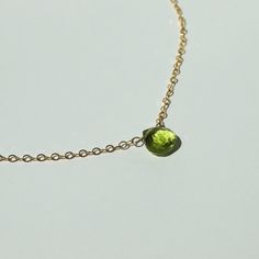 "A vibrant green peridot is suspended by dainty chain. Available in 14k gold filled and sterling silver. (Peridot is August's birthstone!) This necklace is made of high quality materials. We only use 14k gold filled and sterling silver which (unlike plate) will not wear off after multiple wears. All of our silver is Argentium sterling silver, which is a higher quality version of sterling silver that is tarnish resistant and nickel free. Blue Aquamarine Short Pendant will arrive in a gift box. ・M August Birthstone Necklace, Peridot Jewelry, Peridot Pendant, Peridot Necklace, August Birthstone, Dainty Chain, Green Peridot, August Birth Stone, Vibrant Green