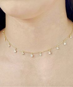 "A gorgeous Gold and Silver Star Choker made for layering with all of your favorite necklace or wear it alone, either way you are guaranteed good vibes. This sterling silver choker has a little dangling CZ star and bezel cubic Zirconia charms. *material Sterling Silver *Stone.  Cubic Zirconia.  *Measurement 12.5\" + 3 \" extender.  *Style Minimalist" Adjustable Delicate Jewelry With Star Charm, Dainty Adjustable Star Charm Necklaces, Dainty Adjustable Star Charm Necklace, Adjustable Star-shaped Necklace With Delicate Chain, Dainty Star Charm Necklaces, Adjustable Dainty Star Jewelry, Dainty Star Charm Choker Necklace, Dainty Choker Necklace With Star Charm, Dainty Star Charm Necklace