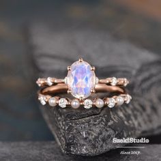 a close up of a ring on top of a rock