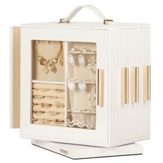 a white jewelry box filled with lots of different items