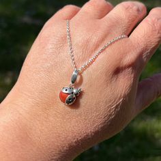 Hop to it with this cute little sterling silver ladybug accenting a vibrant red jasper stone. The lightweight pendant also features a leaf shaped bail, and makes for a choice piece when stacking with other necklaces. Perfect for a nature-lover or anyone looking to add a unique flair to their wardrobe! Overall length: 1 inch (24mm)Overall width: 1/2 inch (13mm) Type: pendant onlyMetal: solid .925 sterling silverGemstone: Chalcedony var. Jasper (N)* * Learn about gemstone enhancement codes. (For r Red Nature-inspired Jewelry For Gifts, Handmade Sterling Silver Charm Necklaces With Teardrop Pendant, Handmade Teardrop Sterling Silver Charm Necklaces, Handmade Sterling Silver Teardrop Charm Necklace, Handmade Sterling Silver Charm Necklace With Teardrop Pendant, Handmade Teardrop Sterling Silver Charm Necklace, Red Handmade Sterling Silver Charm Necklace, Red Sterling Silver Pendant Charm Necklace, Red Sterling Silver Teardrop Pendant Jewelry