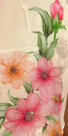 an image of flowers painted on the back of a shirt