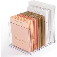 a stack of folders with thank you written on the front and back covers in clear acrylic