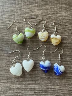 Welcome to my store and if you are looking for a new piece of jewelry for that new outfit, a gift or just something new, you have come to the right store.  Take a look around at all of my lovely pieces and I am sure you will find one that you will like.  🩴This earrings are made with glass hearts and will add flair to any outfit.  ⚠️Note: Colors may vary depending on your monitor  ⚠️ Each pendant is made the same but the design might be slightly different on each one. 🟣I do have other colors fo Glass Hearts, Earrings Heart, Neue Outfits, Glass Heart, New You, Heart Earrings, Murano Glass, New Outfits, Jewelry Earrings Dangle