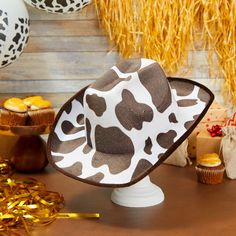 Instantly elevate your costume for a costume party, Halloween party, rodeo, festival, or performance with this fun cowboy hat. The white and brown cow print cowboy hat is ideal for showing off your style while line dancing, bull riding, or simply running errands. The comfortable and breathable EVA velvet will be sure to block out the sun and keep your head cool. The western hat measures 14.2 x 11.5 x 5 inches and has an elastic string to comfortably fit on most youth head sizes. Western White Costume Hats And Headpieces For Summer, White Western Costume Hats And Headpieces For Summer, White Brimmed Costume Hat For Rodeo, White Brimmed Rodeo Costume Hat, Western Style Halloween Costume Hats And Headpieces, White Costume Hat For Western-themed Events, White Brimmed Hat For Rodeo, White Western-themed Costume Hat, Western Hats For Halloween And Western-themed Events