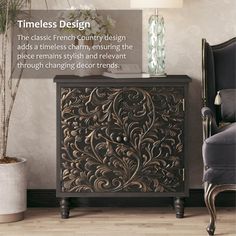 an ornate wooden cabinet sitting on top of a hard wood floor next to a chair