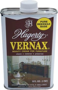 a can of vargey vernax paint on a white table with an antique dresser in the background