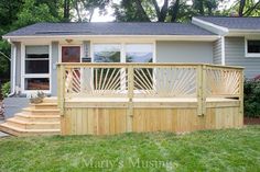 a wooden deck in front of a house