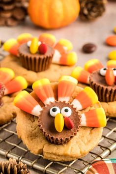 cookies decorated to look like turkeys on a cooling rack