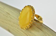 Unique and fashionable ring from Poland. It is made of genuine extremely rare yellow baltic amber with the highest level of quality silver (925), which is gold-plated by 23,5K gold.. It is very elegant jewelry. It is adjustable and suits to everyone. Our all products are made with passion and our customers in mind. Amber dimensions: height: 24 mm width: 16 mm STERLING SILVER 23,5K GOLD Weight: 7.34 g To every order we added a stylish packaging for jewelry Our company specializes in the productio Amber Earrings, Amber Bracelet, Amber Ring, Amber Jewelry, Gold Jewelry Fashion, Jewelry Packaging, Baltic Amber, Gold Plated Silver, Elegant Jewelry