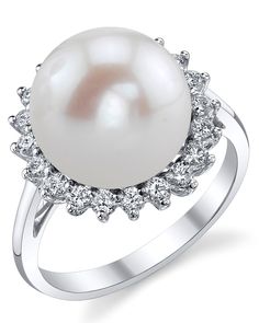 This gorgeous 18K white gold pearl ring is mounted with a beautiful 12-13mm white Freshwater pearl with 'Very High' luster (please see our pearl grading section for more information). This beautiful pearl ring includes .441 carats of SI-quality diamonds and is made of 3.092 grams of the highest quality 18K gold. All pearl rings are approved by our staff of GIA pearl experts and come packaged in a beautiful pearl jewelry box. Please view the options below to customize your pearl ring to your spec White Gold Pearl Ring, Sage Ring, Pearl Rings, Gold Pearl Ring, Freshwater Pearl Ring, Pearl Jewelry Sets, White Freshwater Pearl, Pearl Diamond, Gold Pearl