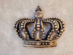 a metal crown is mounted on the wall