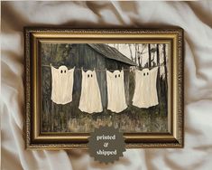 three ghost - like clothes hanging on a line in front of a barn with the words printed and shipped below