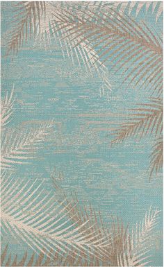 an area rug with palm leaves on the side and light blue, beige and white colors