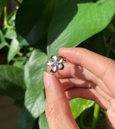 Bring a touch of tropical paradise to your jewelry collection with our silver Flower Ring! This stunning piece is part of our Hana Flowers Collection, inspired by the vibrant flowers that bloom along the Road to Hana, a winding coastal highway on Maui that stretches approximately 64 miles. This silver Flower Ring is more than just a piece of jewelry; it's a reminder of the natural beauty and vibrant spirit of Hawaii. Whether you're treating yourself or looking for the perfect gift, this ring is sure to impress and delight. *Material: Crafted from solid sterling silver with a gold overlay, ensuring durability and a luxurious shine. *Design: Features a delicate flower design adorned with cubic zirconia (CZ) stones, capturing the essence of Hawaiian blooms. *Versatile: Perfect for both casual Coastal Highway, Silver Flower Ring, Road To Hana, Hawaiian Jewelry, 100 Km, Vibrant Flowers, Gold Overlay, Vibrant Flower, Delicate Flower