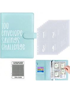 a blue planner with white writing on it and money in front of the pages that spell out 100 envelope savings challenge