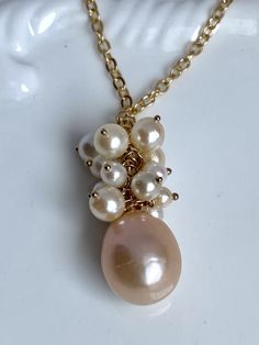 This is a gorgeous iridescent Pearl. Beautiful baroque markings and lovely mauve, pink purple color.   The 14k gold filled chain is 20"  The baroque pearl is from the 70's or 80's. The pearl has a thick nacre and hard to find at this price point.  Handmade at my summer bench in Boston. High Luster Briolette Pearl Necklace As Gift, High Luster Briolette Pearl Necklace For Gift, Briolette High Luster Pearl Necklace Gift, Elegant Iridescent Pearl Necklace For Gift, Pink Pearl Drop Pendant Jewelry, Elegant Pink Pendant Pearl Necklace, Purple Pearl Pendant, Elegant Pink Baroque Pearl Necklace, Luxury Pink Baroque Pearl Necklace