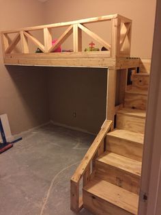 there is a loft bed with stairs in the room