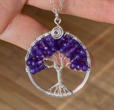 "This beautiful Amethyst Tree of Life Pendant is hand wire wrapped with purple Amethyst gemstone using .925 Sterling Silver wires for the tree trunks an branches. It is a beautiful gift to give or receive! A Birthstone for the February! ~~The pendant measures about between 1.35 to 1.40inch in diameter. The US quarter coin is about 1 inch(25mm) in diameter. ~~The pendant comes on a .925 Sterling Silver cable chain. The chain is flexible and durable enough to hold the pendant. if you would like di Nickel-free Amethyst Pendant Jewelry, Nickel-free Silver Amethyst Jewelry, Purple Wire Wrapped Pendant Jewelry, Purple Sterling Silver Wire Wrapped Jewelry, Purple Gemstone Beads For Jewelry Making, Wire Wrapped Purple Jewelry Gift, Amethyst Crystal Necklaces For Jewelry Making, Spiritual Amethyst Pendant Jewelry, Purple Pendant Jewelry With Natural Stones