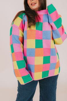 Fashionably transition between seasons in this vibrant PLUS SIZE - Between Places Sweater! With its cheerful multi-colored checker pattern, ribbed neckline, and pullover style, you can make a statement while staying comfortable. Details Multi-color blocked checker pattern Pullover sweater Ribbed neckline Colors are pink, blue, lime, orange, and green Sizing *Measurements are taken unstretched with item hanging* Approximate measurements: SIZE LENGTH BUST 1XL 29.5" 54" 2XL 30" 56" 3XL 30.5" 58" Fa Nursing Friendly Tops, Daily Dresses, Nursing Friendly Dress, Plus Jumpsuit, Checker Pattern, Party Sweaters, Mama Style, Exclusive Dress, Orange And Green