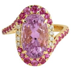 This ring has been meticulously crafted from 18-karat gold. It is hand set with 6.39 carats kunzite, 1.02 carats sapphire & .35 carats of sparkling diamonds. FOLLOW MEGHNA JEWELS storefront to view the latest collection & exclusive pieces. Meghna Jewels is proudly rated as a Top Seller on 1stDibs with 5 star customer reviews. All items manufactured by us are handmade and can be customized or redesigned. Composition Ring size US-7 Size - 21X17 MM Gold Weight - 5.352 gm Gemstone - Kunzite (6.39 Ct Top Seller, Sparkle Diamonds, Bridal Rings, Diamond Gemstone, Cocktail Rings, Beautiful Things, Gold Ring, 5 Star, Wedding Engagement