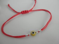 All you need to be protected against the evil eye. This little eyes are about 6mm and the bracelets are adjustable for a perfect fit. This listing is for ONE bracelet, you can choose the eye color and the cord color. eye colors are: blue, red, yellow, green and purple. cord colors are: red, white, gray, black, pink, brown, navy, purple, light blue, green neon, hot pink neon... If you prefer them with a CLASP follow this link: https://www.etsy.com/listing/89266477/evil-eye-bracelet -------------- Adjustable Evil Eye Friendship Bracelet, Adjustable Evil Eye Bracelet For Friendship, Adjustable Evil Eye Friendship Bracelets, Adjustable Evil Eye Bracelet With Sliding Knot, Adjustable Round Evil Eye Bracelet, Casual Adjustable Evil Eye Bracelet As Gift, Adjustable Spiritual Evil Eye Bracelet With Sliding Knot, Casual Evil Eye Friendship Bracelets As Gift, Casual Evil Eye Friendship Bracelets For Gifts