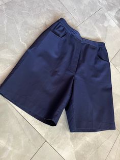 "Vintage navy blue military style shorts made by Traditions. Elastic waist, faux fly with pockets. Tagged as a size 12, measures 13\" across waist, 21\" hips, 13\" rise, 20\" long." Solid Color Shorts With Short Inseam And Pockets, Shorts With Pockets And Short Inseam, Solid Shorts With Pockets And Short Inseam, Solid Workwear Shorts With Pockets, Solid Color Bermuda Shorts With Pockets, Solid Bermuda Shorts With Pockets, Workwear Shorts With Pockets, High-waisted Shorts With Pockets, Solid Color High-waisted Shorts With Pockets