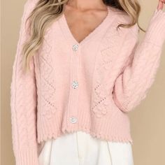 This Cardigan Features A V-Neckline When Buttoned, A Cable Knit Design, Rhinestone Encrusted Button Closure, And Ribbed Cuffs. 73% Acrylic, 15% Nylon, 10% Wool, 2% Span Hand Wash Cold Unlined Imported Elegant Pink V-neck Cardigan, Elegant Pink Sweater With Button Closure, Feminine V-neck Cardigan For Fall, Elegant Pink Cardigan With Button Closure, Feminine V-neck Cardigan, Elegant Pink V-neck Sweater, Brandy Sweater, Green Sweater Cardigan, Free People Cardigan